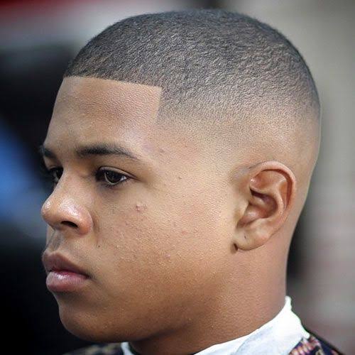 Man with high bald fade and sharp squared hairline, side profile